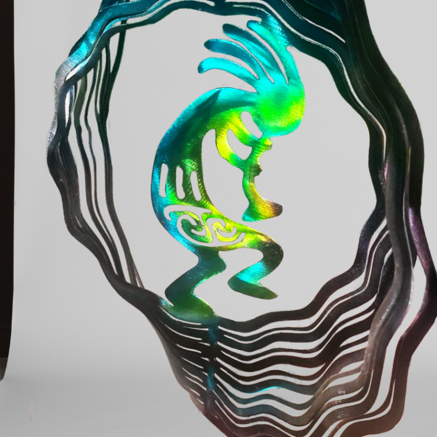 Desert Art, Kokopelli is a mythical creature who makes music. He is a Trickster, musician, and helps with fertility. Metal Art wind spinner kinetic motion with bright colors- green, yellow, blue, purple and navy. Kokopelli art for desert landscapes. Kokopelli is a mystical creature metal art wind spinner