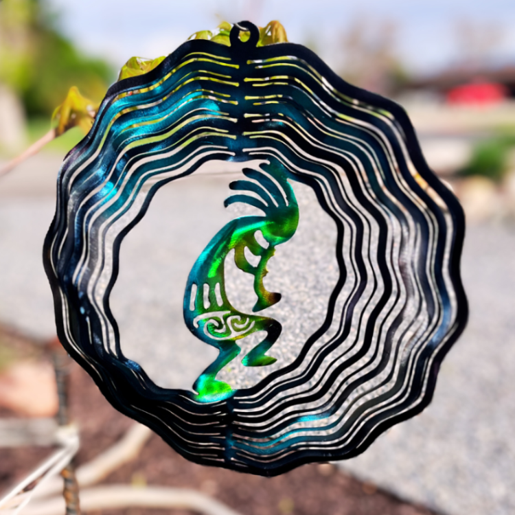 Desert Trickster, musician, and fertility. Metal Art wind spinner kinetic motion with bright colors. Fertility God, music maker, desert magic. Kokopelli is a mystical creature metal art wind spinner