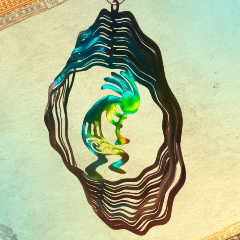 Desert Trickster, musician, and fertility. Metal Art wind spinner kinetic motion  with bright colors. Fertility  God, music maker, desert magic. Kokopelli is a mystical creature metal art wind spinner