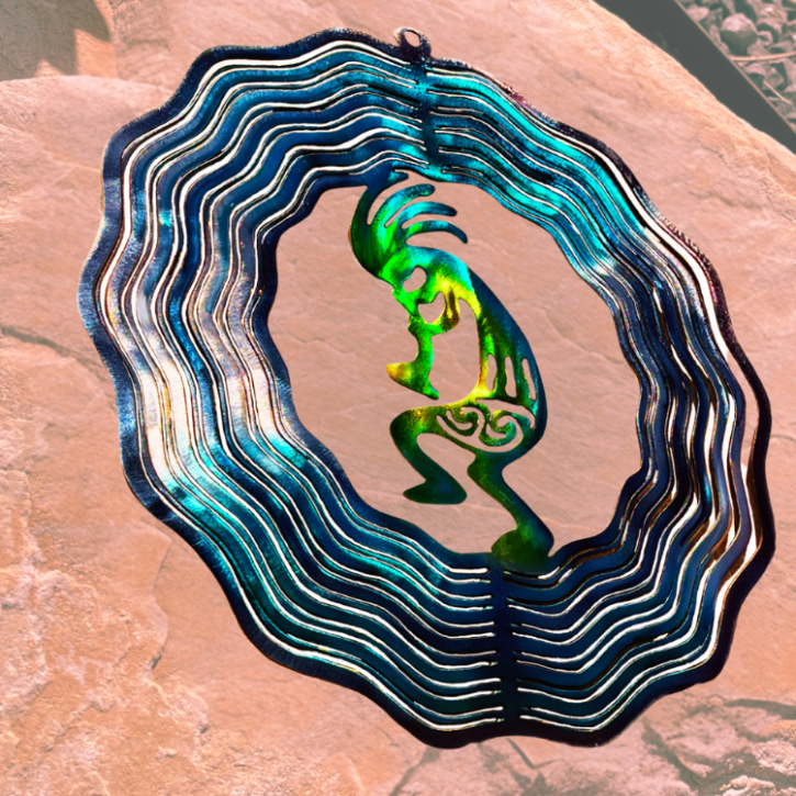 Desert Trickster, musician, and fertility. Metal Art wind spinner kinetic motion  with bright colors. Fertility  God, music maker, desert magic. Kokopelli is a mystical creature metal art wind spinner