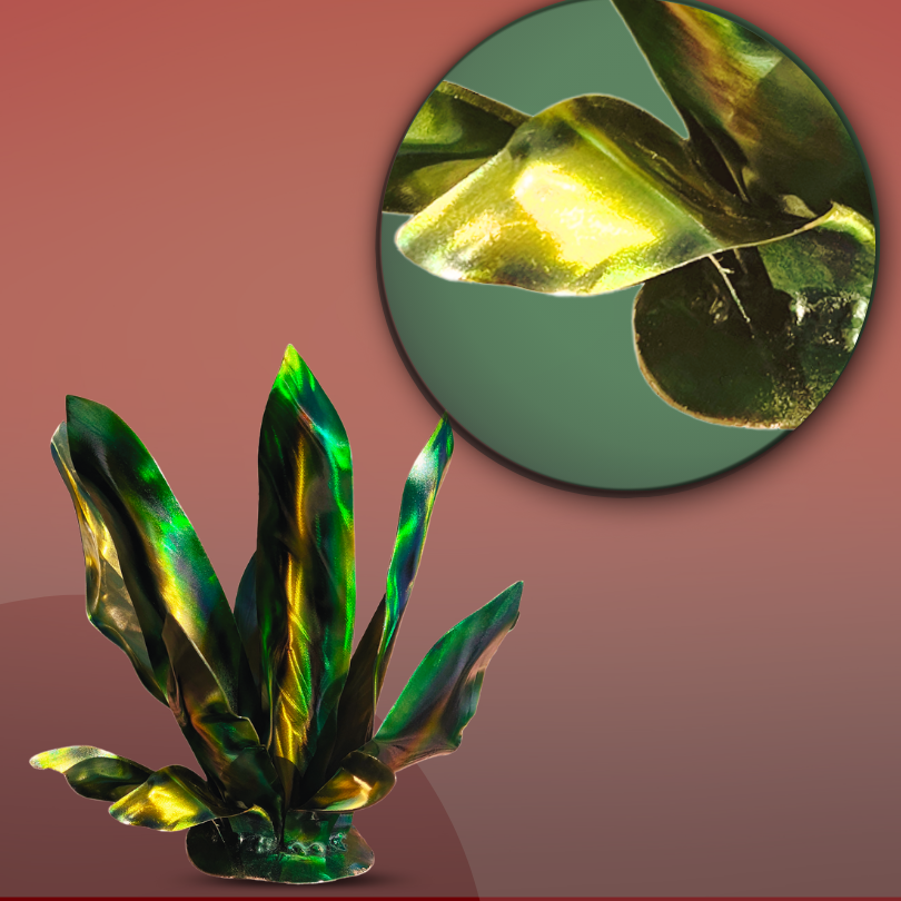 Green, Yellow, Gold, Metal garden art agave, on a red tone background, with a circle zoomed in to display the metal leaves and color of the art piece. Vibrant agave leaves painted with patina dyes