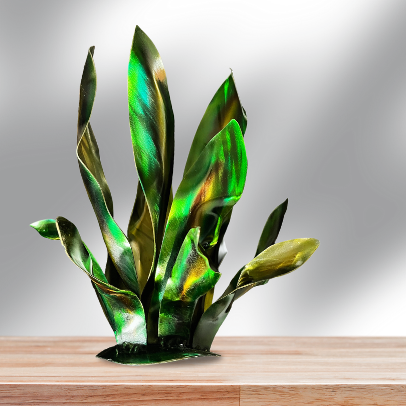 Green, Yellow, Gold, Metal garden art agave, on a wooden shelf Vibrant agave leaves painted with patina dyes. Metal artistic leaves welded together onto a round base. leaves shaped and bent into twisted shapes to make agave